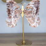 Intuition: ailes de papillon en agate sur stand doré